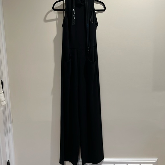 Black jumpsuit with pockets and cut out back - Picture 1 of 4